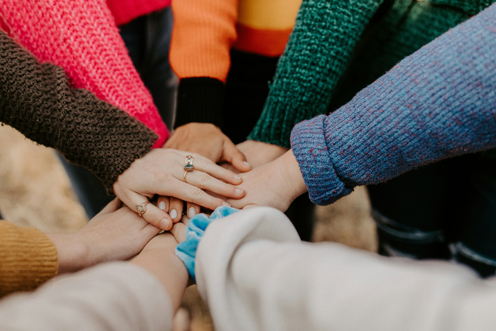 Group of hands meeting in the middle