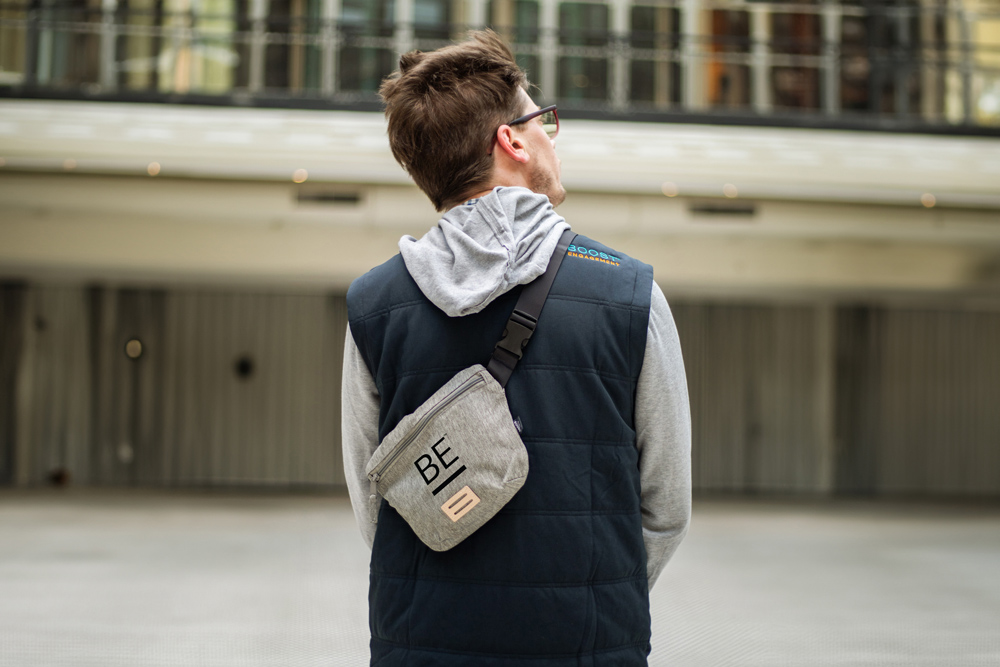 Man in Boost Engagement branded vest and fanny pack